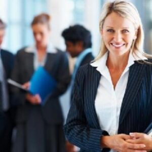 Cute business woman with colleagues in discussion at the background