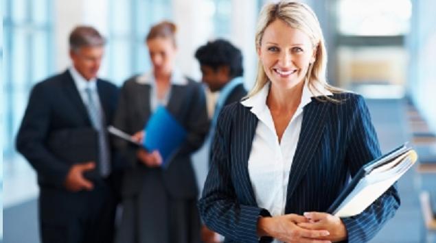 Cute business woman with colleagues in discussion at the background